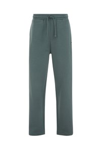 Tamnotegetalne trenirke od meke mješavine pamuka, s elastičnim pojasom i vezicama, bočnim džepovima i opuštenim krojem.