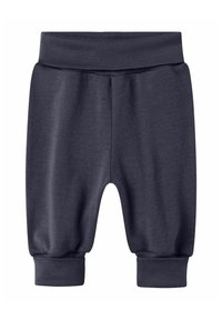 Mörkgrå sweatpants tillverkade av mjuk material, med elastisk midja och elastiska manschetter vid anklarna, i avslappnad passform.