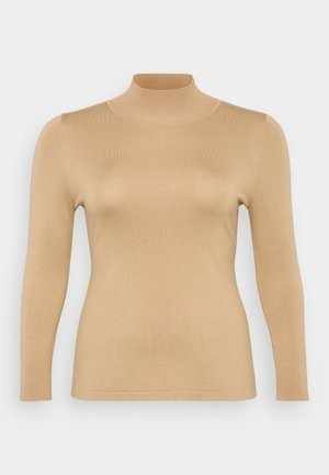 Top beige de cuello alto con mangas largas, textura acanalada, diseño ajustado y un alto cuello. Material suave sin adornos visibles.