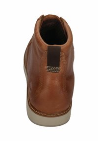 Brown leather ankle boot with rounded toe, textured surface, stitched design, and a brown fabric pull tab at the heel.
