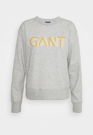 Sweat-shirt gris clair à col rond avec manches longues et logo "GANT" en lettres rayées jaunes et orange sur la poitrine.