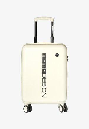 Crèmekleurige harde koffer met verticaal "momoDESIGN" logo, telescopische handgreep en vier zwenkwielen.