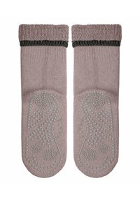 Lila gestrickte Socken mit einem strukturierten, dunkelgrünen Rippbund. Rutschfeste Silikonelemente an den Sohlen mit einem dekorativen Muster.