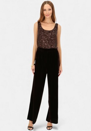 - Spodnie materiałowe