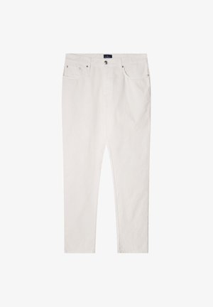 Biele bavlnené nohavice so striha rovného nohavic, päť vreciek a predným zapínaním na gombík. Hladká textúra a minimalistické detaily.