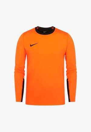 Maglia sportiva a maniche lunghe color arancione brillante con logo Nike nero sul petto e dettagli neri all'interno del colletto e delle maniche.