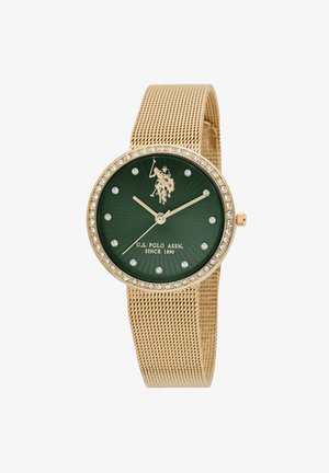 Orologio in rete dorata con quadrante verde, dettagli in cristallo e un'emblema di un giocatore di polo al centro. Presenta lancette delle ore e dei minuti dorate.