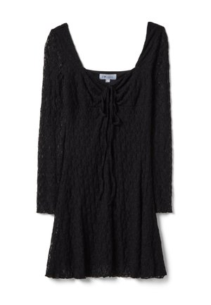 Mini abito nero in pizzo con maniche lunghe, scollo quadrato e dettaglio con fiocco sul davanti, aderente al busto e svasato nella gonna.