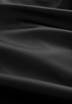 Black fabric with a smooth texture, featuring soft, flowing folds and subtle sheen, without patterns or hardware visible.