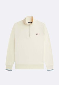 Maglione crema con cerniera e collo alto, con stemma logo color bordeaux sul petto e dettagli a strisce blu e bianche sui polsini.