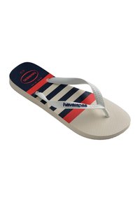 Tongs blanches avec des rayures bleu marine et rouge sur la semelle, des brides blanches et le logo "havaianas" sur la bride et la semelle.