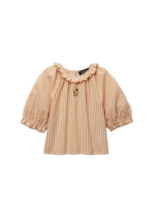 Blouse vichy orange et blanche avec manches bouffantes, encolure à volants et petite broderie de tournesol sur la poitrine.