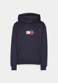 Sweat à capuche bleu marine avec poche kangourou devant et logo Tommy Hilfiger rouge, blanc et bleu sur la poitrine.