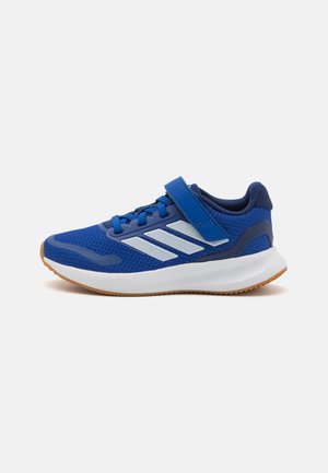 Blue athletic shoes with a mesh upper, white midsole, and rubber outsole. Features Velcro strap and contrasting white accents on sides.