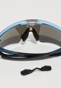 Blue sports sunglasses with a glossy finish, mirrored lenses, and adjustable black ear grips. Includes a separate black nose pad.