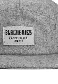 Gray felt cap with a flat brim. Features a white label embossed with "BLACKSKIES" and "ALWAYS ONE STEP AHEAD SINCE 2009."