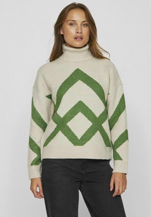 Pull crème avec des motifs géométriques en losange verts, un col roulé haut et des poignets côtelés. Texture douce, coupe décontractée.