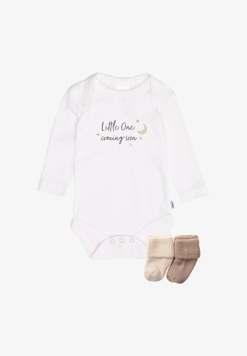 White long-sleeve onesie with "Little One coming soon" text and small stars; includes two pairs of soft socks in cream and light brown.