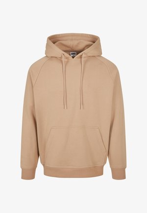 Beige hoodie met een kangoeroezak, geribbelde manchetten en zoom. Gemaakt van zachte stof met een ontspannen pasvorm en raglanmouwen.