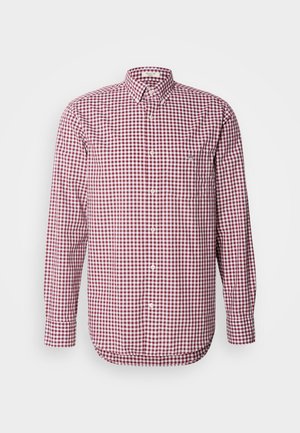 Camisa de cuadro rojo y blanco, de manga larga, con cuello y bolsillo en el pecho. Fabricada con tejido ligero y de textura suave.