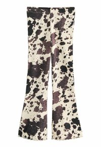 Geribbelde flare-pantalon in crème met zwarte en bruine vlekkenpatronen. Kenmerkt zich door een aansluitende tailleband en een zigzag-afwerking aan de onderkant.