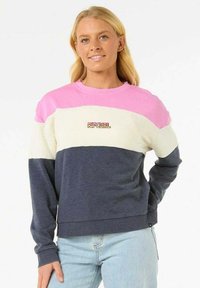 Felpa a blocchi di colore con sezioni rosa, crema e blu navy. Realizzata in tessuto morbido con polsini a costine e un piccolo logo sulla parte anteriore.