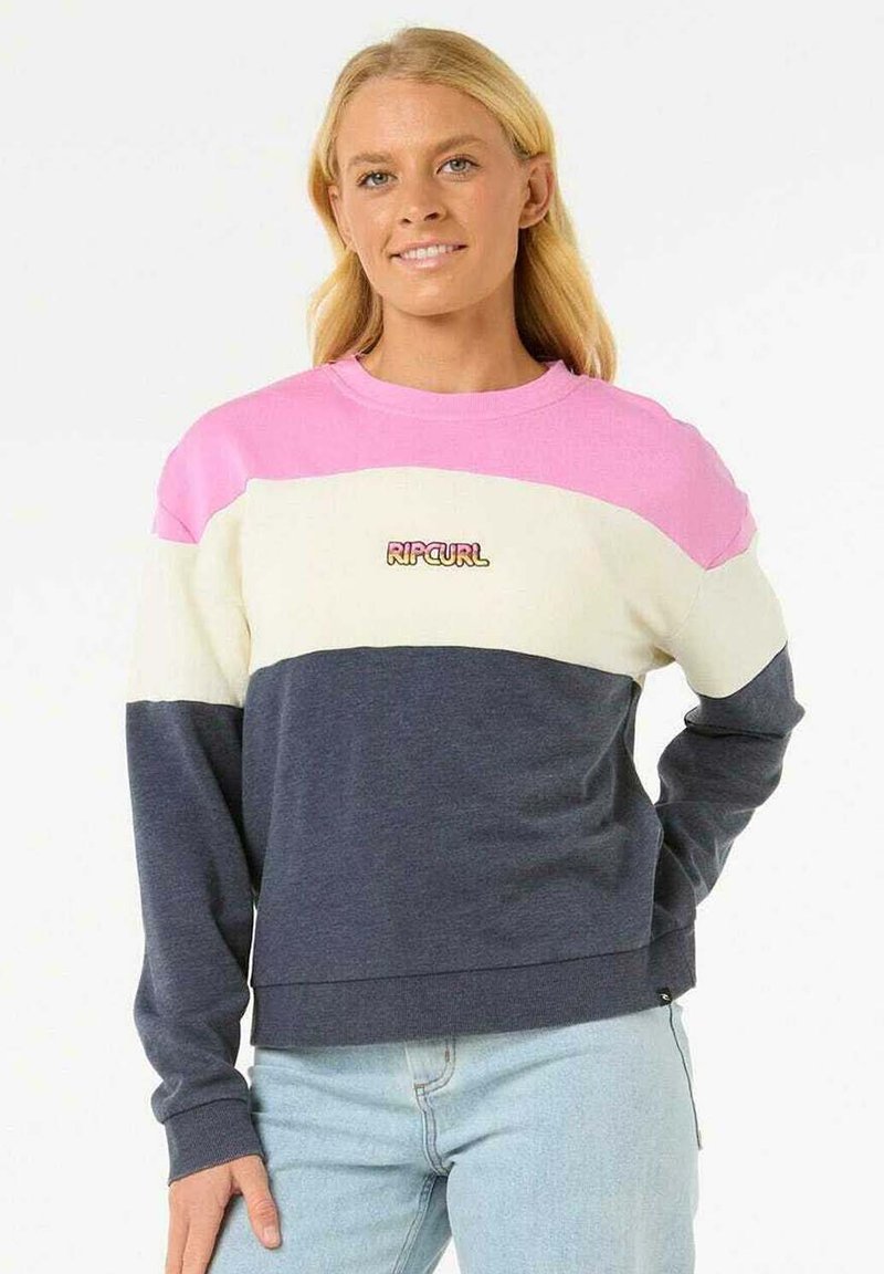 Felpa a blocchi di colore con sezioni rosa, crema e blu navy. Realizzata in tessuto morbido con polsini a costine e un piccolo logo sulla parte anteriore.