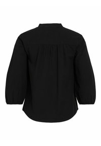 Blusa nera con yoke posteriore, maniche a sbuffo e orlo arrotondato. Realizzata in tessuto testurizzato, con colletto a bottoni e dettagli arricciati.