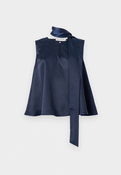 Navy satin sleeveless top featuring a keyhole detail, flowing design, and a long scarf tie at the neck, with smooth texture and drape.