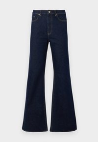 Jeans de ganga boca de sino em azul escuro, com cintura alta, bolsos à frente e detalhes em costura dourada. Textura suave com um corte tradicional.
