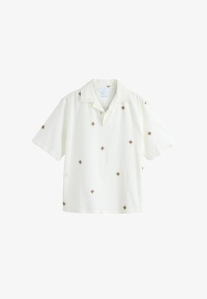 Camicia a maniche corte con colletto in tessuto color crema, caratterizzata da ricami a diamante marroni su tutta la superficie. Progettata con una vestibilità comoda e una texture morbida.