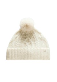 Valkoinen neulottu pipo, jossa on kaapeli-kuvio ja ribattu reunus, huipulla pörröinen tupsu. Reunuksessa on pieni logo.