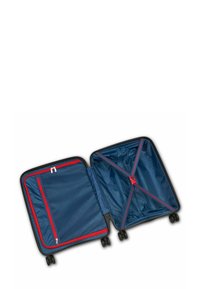 Black wheeled suitcase with a navy interior. Features a red zipped pocket and cross straps for securing belongings; smooth fabric texture.