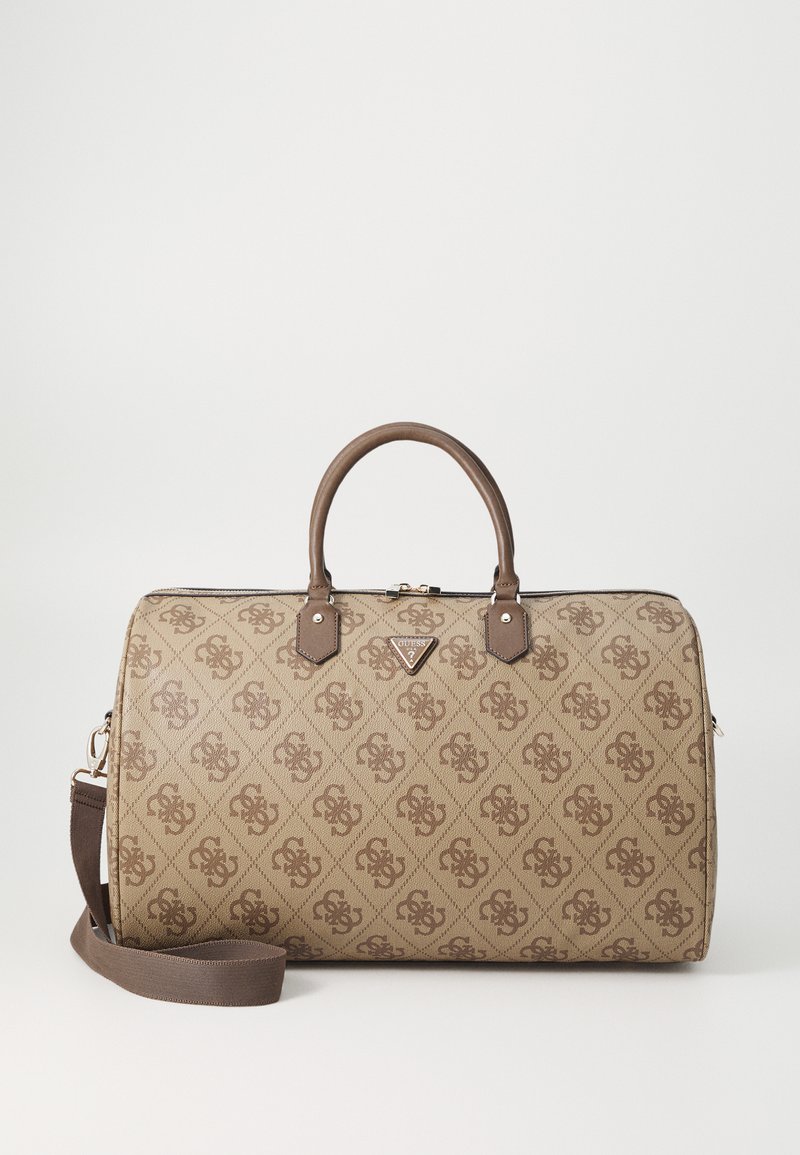 Beige patterned handbag with brown accents, top handles, and adjustable shoulder strap. Features logo and zipper closure. Textured material.