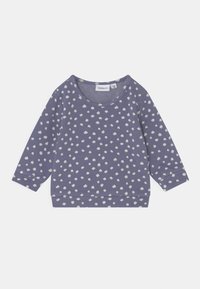 Sweatshirt roxo com padrão de bolinhas brancas, gola redonda e mangas longas. Tecido suave com um caimento descontraído.