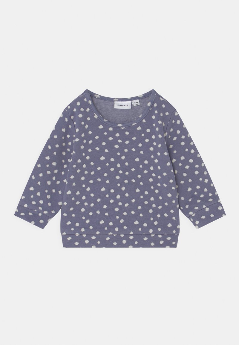 Sweatshirt roxo com padrão de bolinhas brancas, gola redonda e mangas longas. Tecido suave com um caimento descontraído.