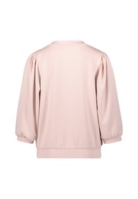 Ljusrosa tröja med rundad nacke, voluminösa puffärmar och en åtsittande nederkant. Slät textur, minimal design.