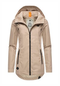 Beige waterproof jacket with a lined hood, front zipper, two side pockets, and a curved hem. Features contrasting black zippers and accents.
