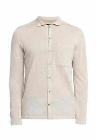 Beige langarmshirt van zacht stof, met een kraag, knoopsluiting aan de voorkant, een enkele pocket en een subtiele textuur. Zilveren knopen.