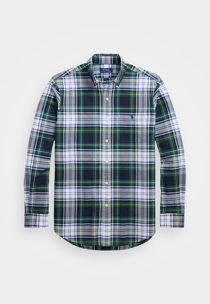 Grøn, blå og hvid plaid langærmet skjorte med knaplukning, brystlomme og buet kant. Stoffet har en blød tekstur. Polo-logo på lommen.