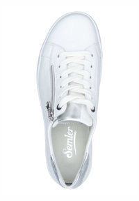 White leather sneaker with a round toe, flat laces, and a side zipper. Features a silver accent at the heel and a cushioned insole.
