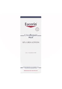 Eucerin UreaRepair Plus 10% Urea Lotion in a tall, white bottle with blue accents. Text highlights urea, ceramide, and NMf for dry skin.