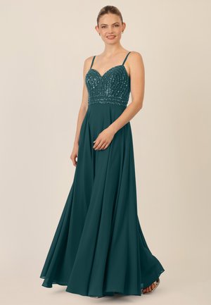 Teal evening gown with a fitted, sequined bodice and a flowing, full-length skirt. Features thin straps and a sweetheart neckline.