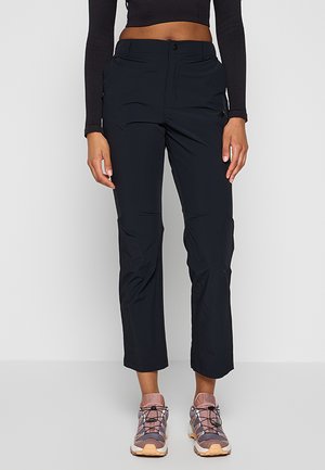 Czarne, lekkie, wodoodporne spodnie o prostym kroju. Posiadają zapięcie na guzik i zamek z boku oraz kieszenie boczne.