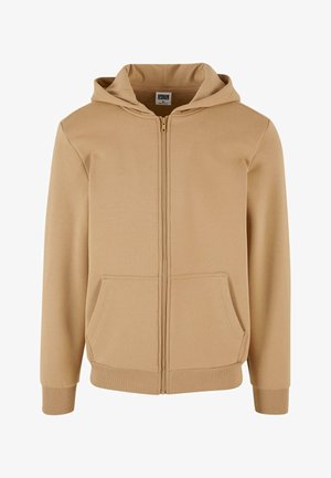 Hanorac crem cu fermoar, fabricat dintr-un amestec moale de bumbac. Are un glugă cu șnur, două buzunare frontale și manșete și tiv din material ribatat.