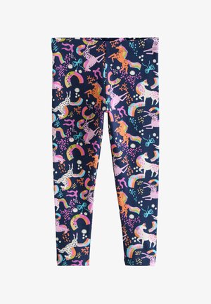 Tmavomodré legíny s farebnými jednorožcami, dúhami, mašľami a kvetinovými vzormi rozptýlenými po látke.