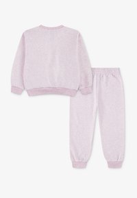 Light pink sweatpants and matching crewneck sweatshirt, featuring ribbed cuffs and waistband, made from soft, textured fabric.
