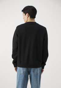 HUGO DURAGOL - Bluză de molton - black