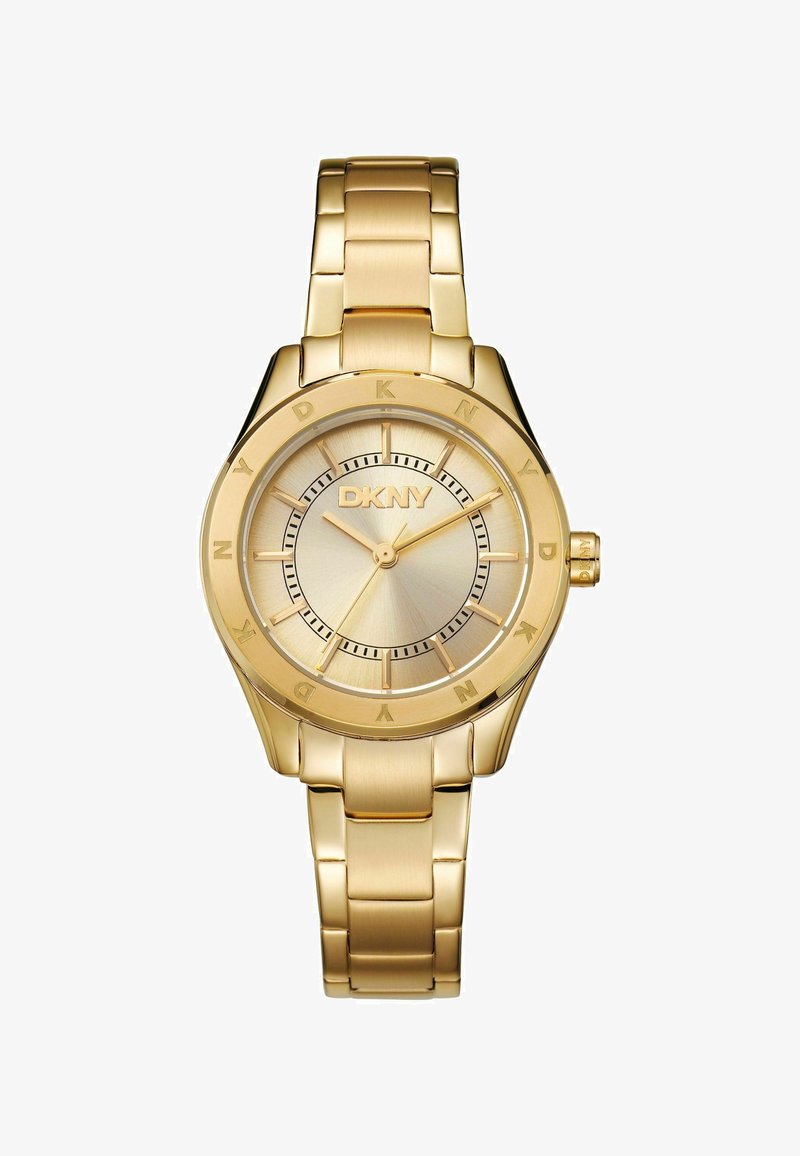 Gouden metaal horloge met een ronde kast, geborstelde gouden wijzerplaat en een gouden schakelarmband. Heeft een geëtst middenstuk en het DKNY-logo op de wijzerplaat.