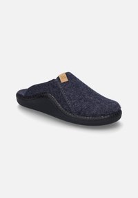 Pantofola in feltro di lana blu navy con suola in gomma nera, design curvato e un'etichetta in pelle color cuoio con le lettere "J.S." sul lato.